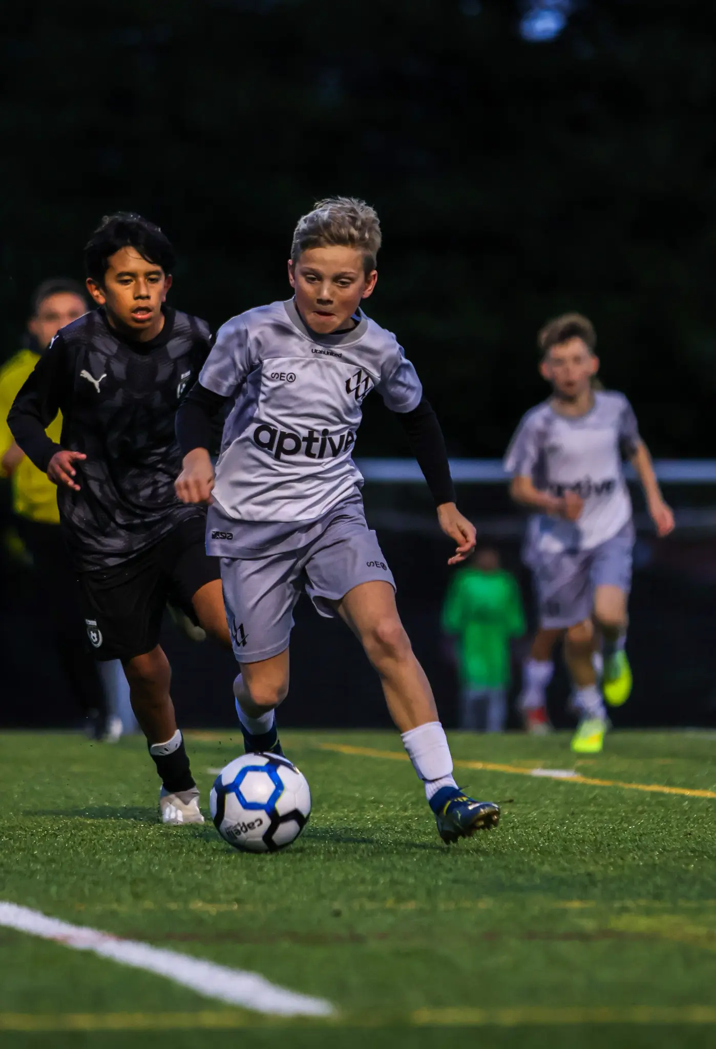 Night game action at the GOAT Soccer Cup